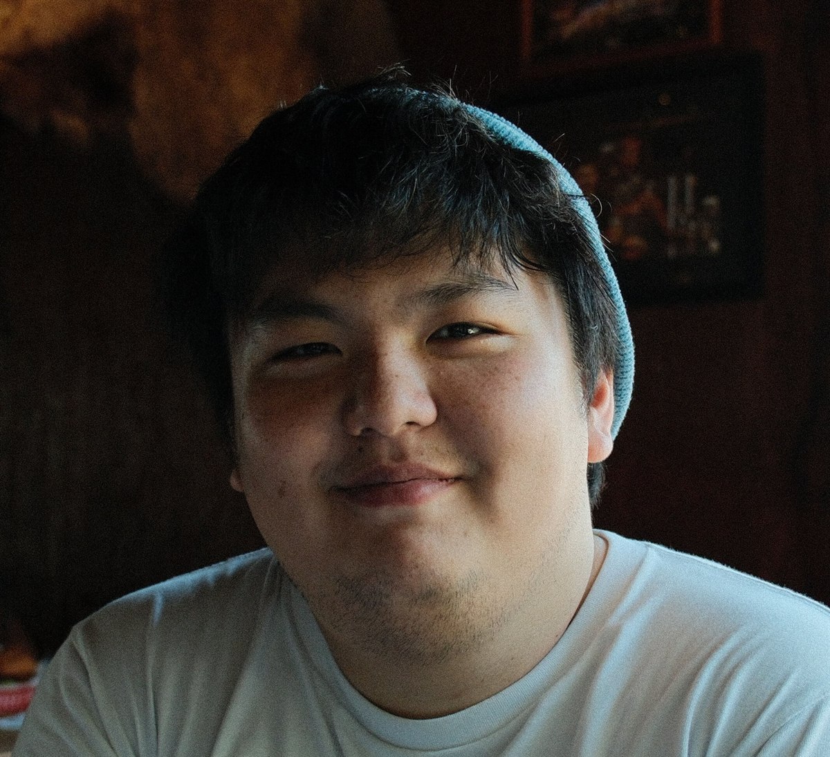 ha-joon “daniel” park smiling in a softly lit restaurant